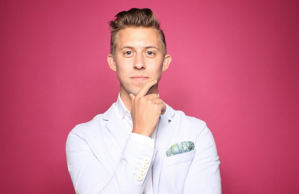 man in white suit jacket