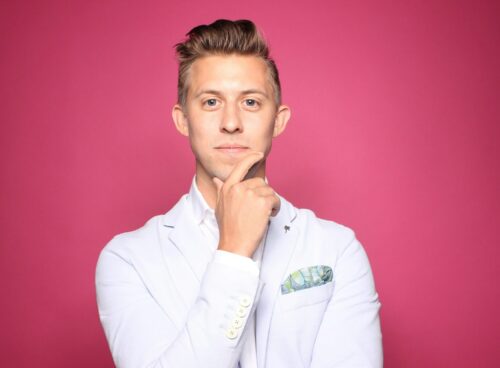 man in white suit jacket