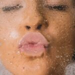 woman in water with water droplets