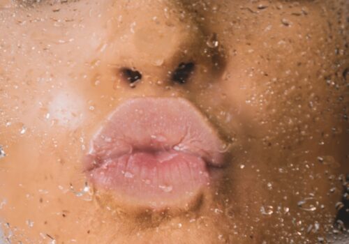 woman in water with water droplets