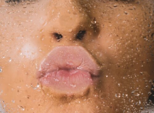 woman in water with water droplets