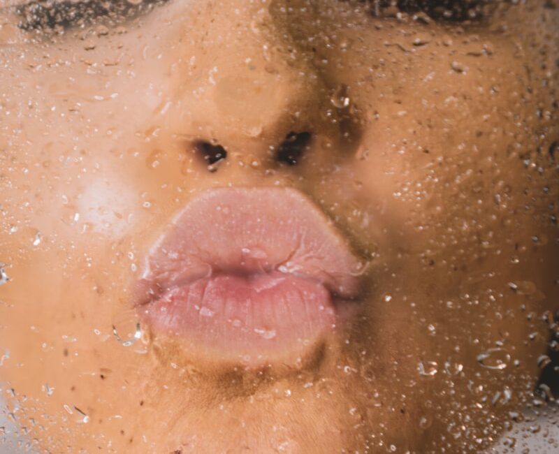 woman in water with water droplets