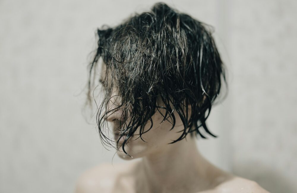 topless woman with black hair