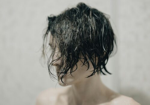 topless woman with black hair