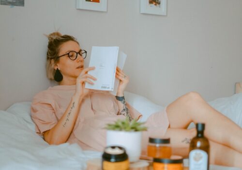 unknown person reading book indoors