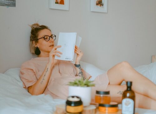 unknown person reading book indoors