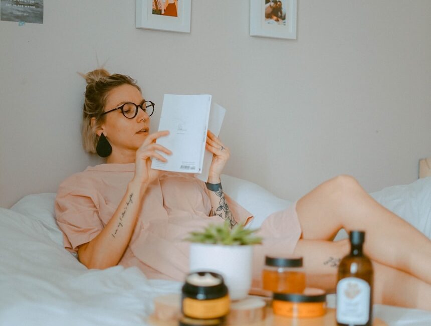unknown person reading book indoors