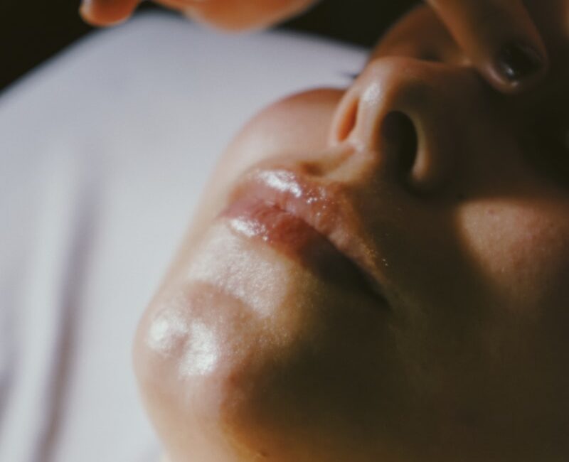 a woman getting a facial massage on her face