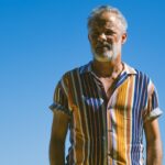 a man standing with his hands in his pockets