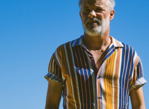 a man standing with his hands in his pockets