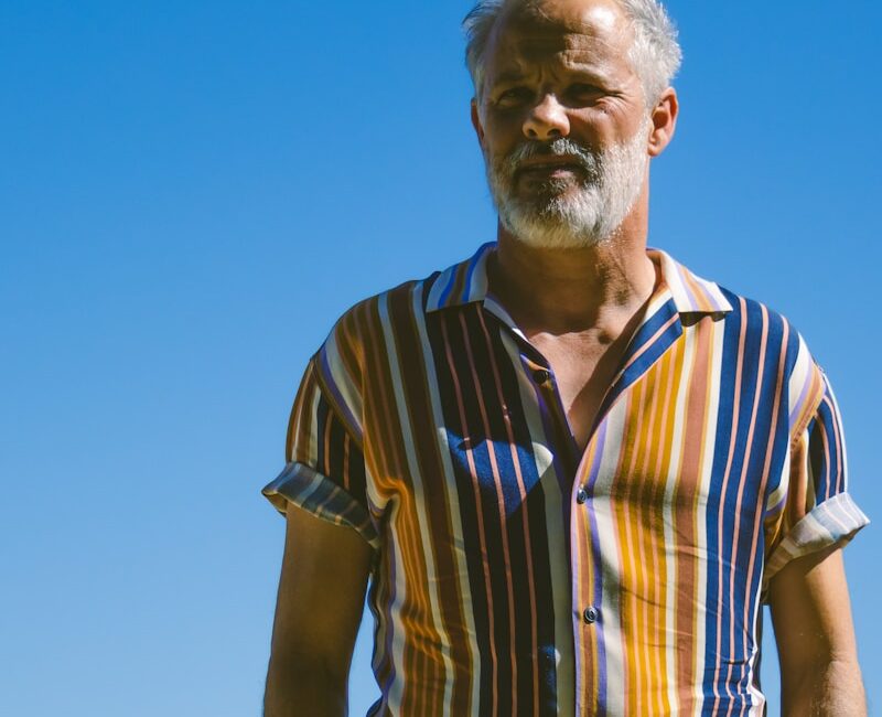 a man standing with his hands in his pockets