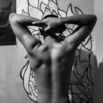 person standing in front of wall