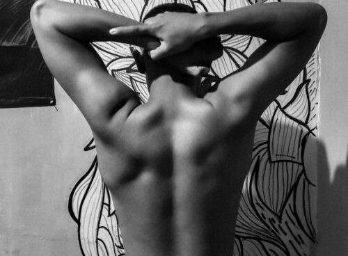 person standing in front of wall