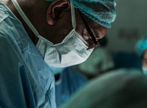 man wearing medical mask and robe