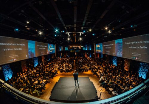 people sitting on chairs watching a game