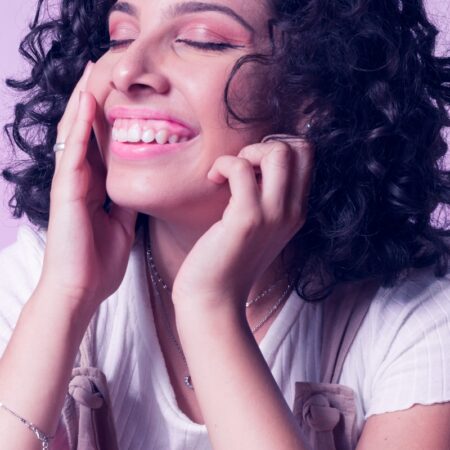 a close up of a person with curly hair