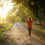 woman walking on pathway during daytime